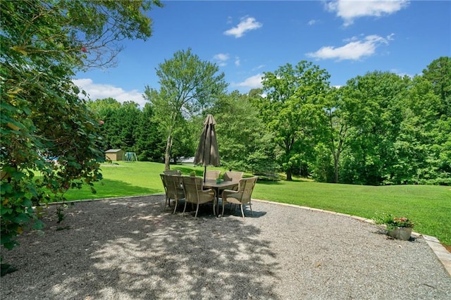 view of patio featuring a storage unit