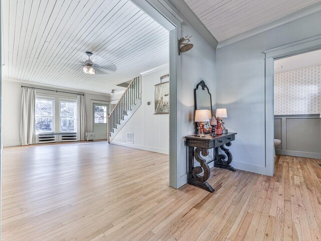 entrance foyer featuring crown molding, ceiling fan, light hardwood / wood-style flooring, and wooden ceiling