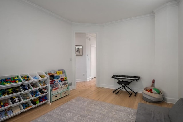 907 Edgewood Ave NE, Atlanta, GA 30307 - playroom with ornamental molding, wood finished floors, and baseboards