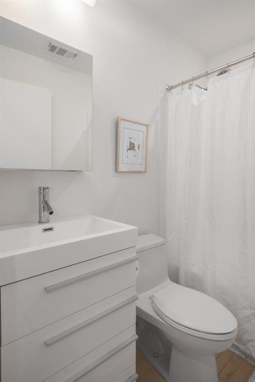 907 Edgewood Ave NE, Atlanta, GA 30307 - full bath with toilet, vanity, and curtained shower