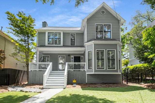 907 Edgewood Ave NE, Atlanta, GA 30307 - view of front of house with stairway, a chimney, and a porch
