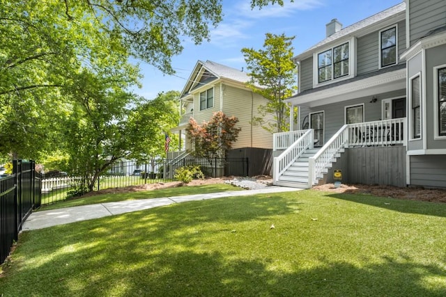907 Edgewood Ave NE, Atlanta, GA 30307 - view of front of home featuring stairs, covered porch, and a chimney