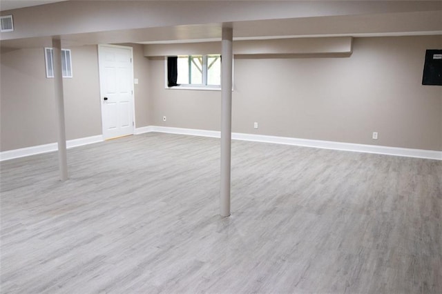 basement with hardwood / wood-style floors