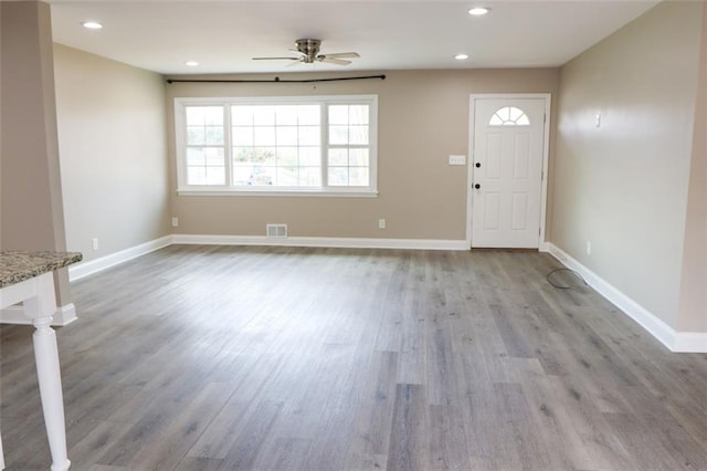 entrance foyer with light hardwood / wood-style flooring and ceiling fan