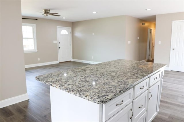 kitchen featuring white cabinets, dark hardwood / wood-style floors, and ceiling fan