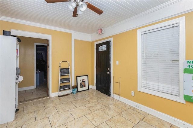 entryway featuring crown molding, baseboards, and ceiling fan