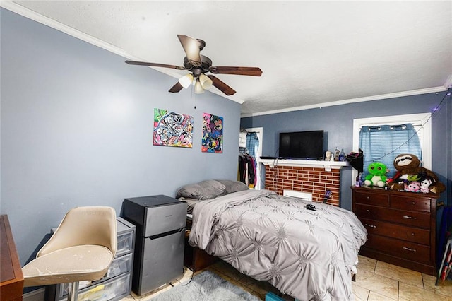 bedroom with ornamental molding and a ceiling fan