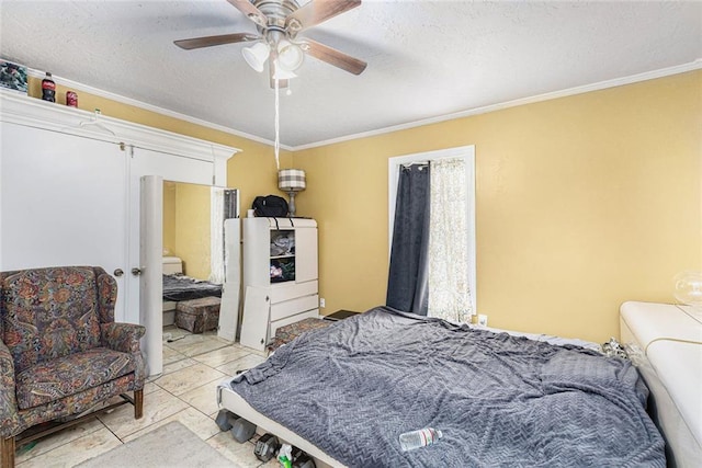 bedroom with a textured ceiling, ceiling fan, and crown molding