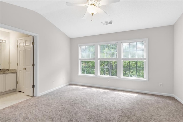 2754 Terrell Trace Dr, Marietta, GA 30067 - unfurnished bedroom with light colored carpet, baseboards, lofted ceiling, connected bathroom, and ceiling fan