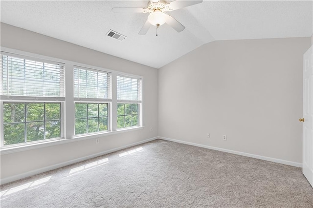 2754 Terrell Trace Dr, Marietta, GA 30067 - empty room featuring carpet, lofted ceiling, a textured ceiling, baseboards, and ceiling fan