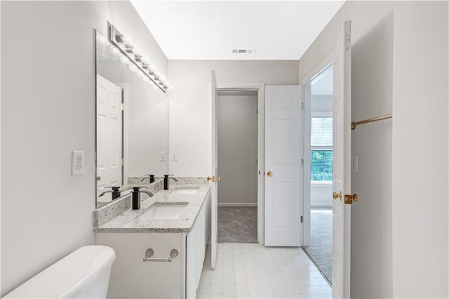 2754 Terrell Trace Dr, Marietta, GA 30067 - bathroom with toilet, double vanity, tile patterned floors, and baseboards