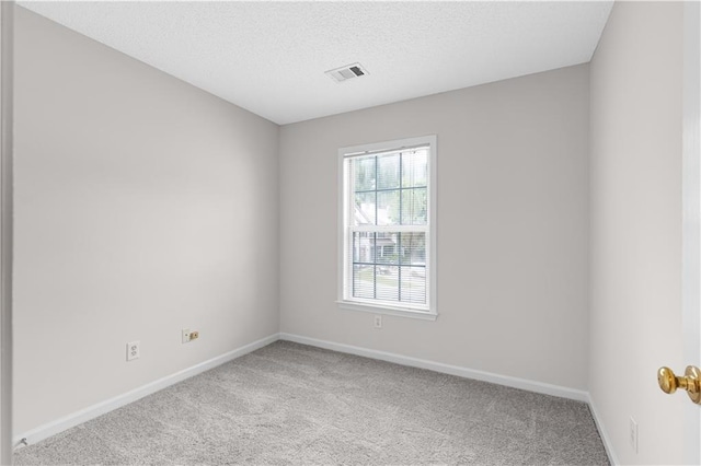 2754 Terrell Trace Dr, Marietta, GA 30067 - empty room featuring light colored carpet, baseboards, and a textured ceiling