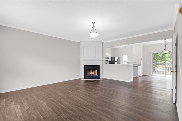 2754 Terrell Trace Dr, Marietta, GA 30067 - unfurnished living room with dark wood-type flooring, ornamental molding, baseboards, and a large fireplace