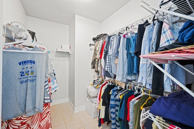 walk in closet featuring light tile patterned floors