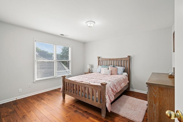 bedroom featuring dark wood-type flooring