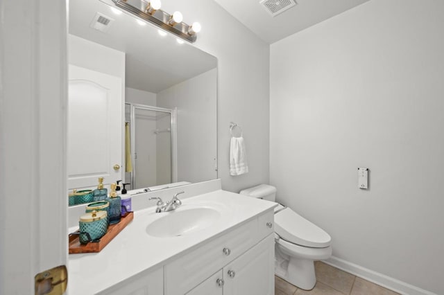 bathroom with tile patterned flooring, vanity, toilet, and an enclosed shower