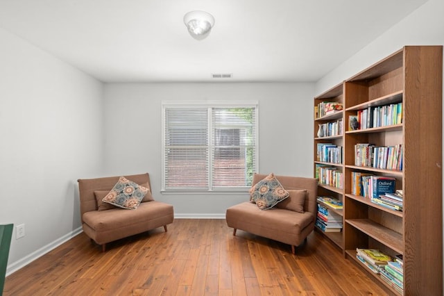 sitting room featuring wood-type flooring