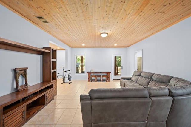 living room with light tile patterned floors and wooden ceiling