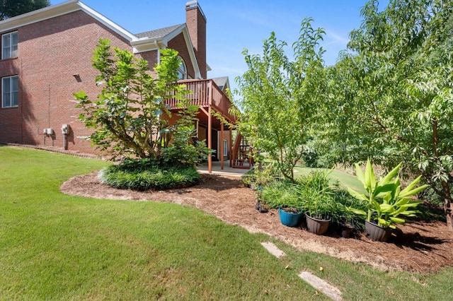 view of yard with a wooden deck