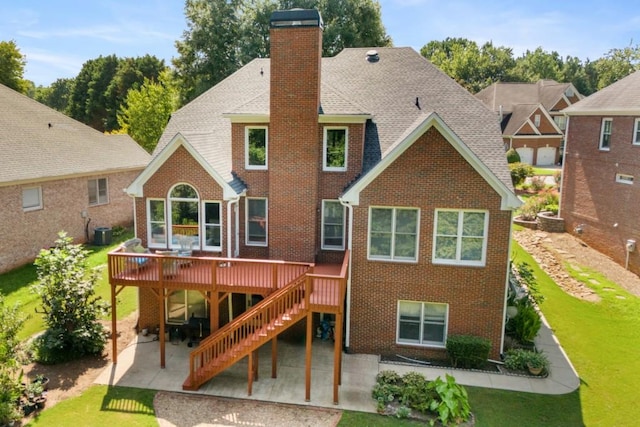 back of house with a lawn, a patio area, central AC, and a deck