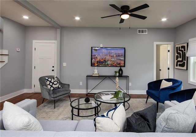 living room with hardwood / wood-style floors and ceiling fan