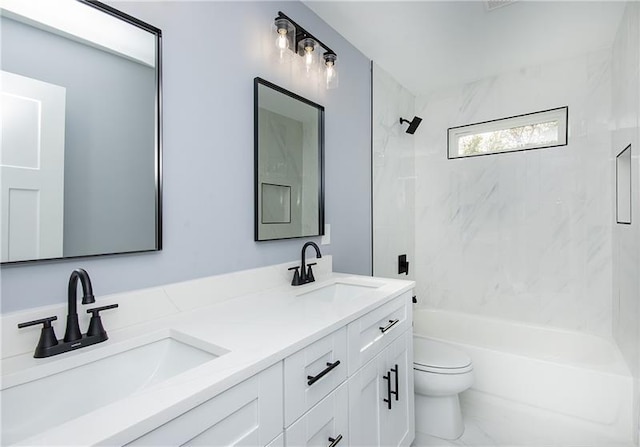 full bathroom with tiled shower / bath combo, vanity, and toilet