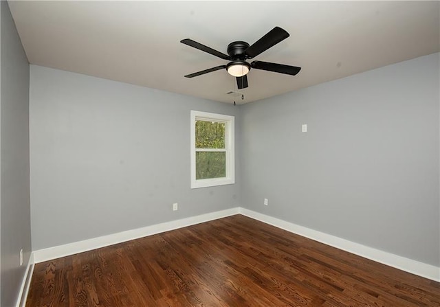 spare room with hardwood / wood-style floors and ceiling fan