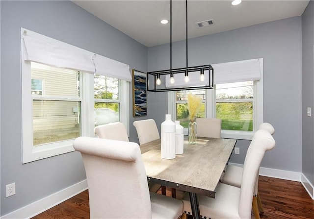 dining room with dark wood-type flooring