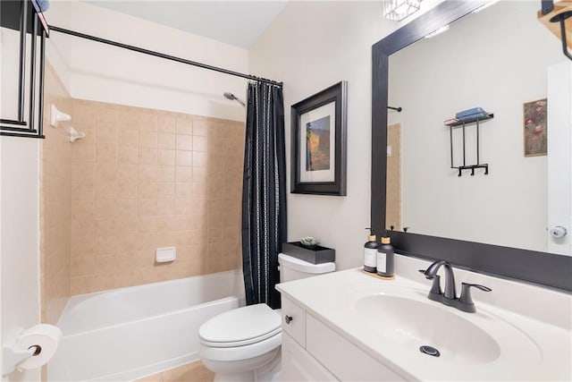 bathroom with vanity, shower / bath combination with curtain, and toilet