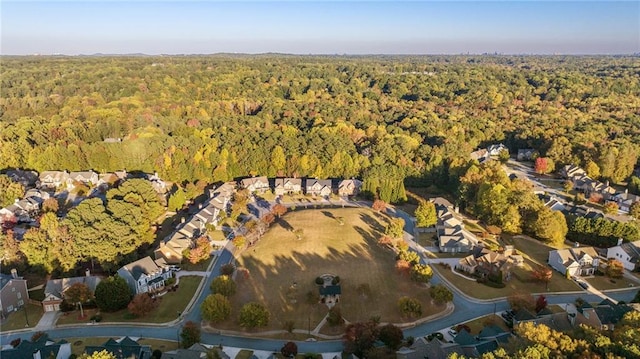 birds eye view of property with a forest view