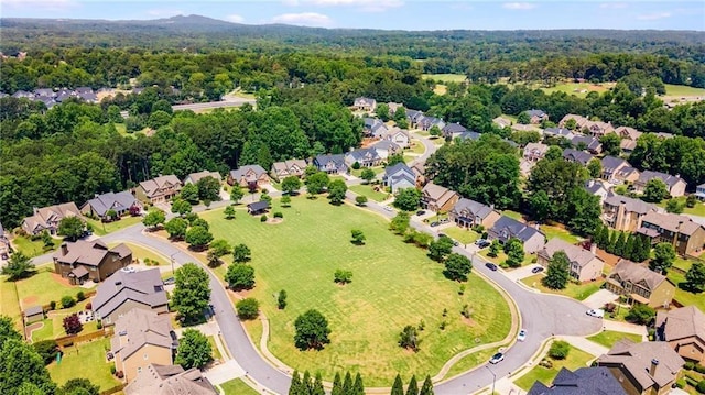 bird's eye view with a residential view and a wooded view