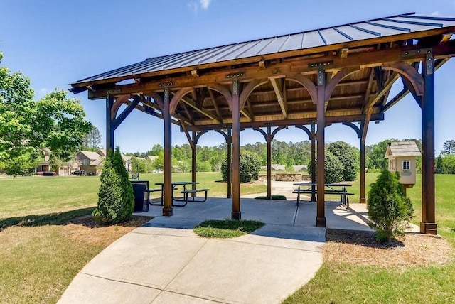 surrounding community featuring a patio, a lawn, and a gazebo