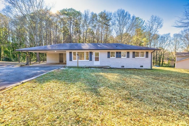 ranch-style house with a front lawn and a carport