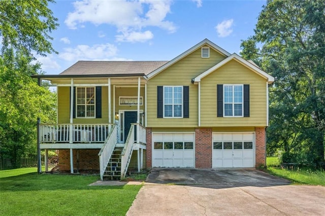 60 Boardwalk Ave, Covington, GA 30016 - bi-level home with driveway, a garage, covered porch, a front lawn, and brick siding