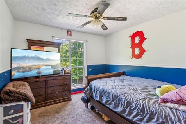 60 Boardwalk Ave, Covington, GA 30016 - carpeted bedroom featuring a textured ceiling and a ceiling fan