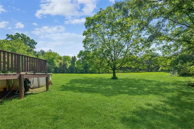 60 Boardwalk Ave, Covington, GA 30016 - view of green lawn featuring a wooden deck