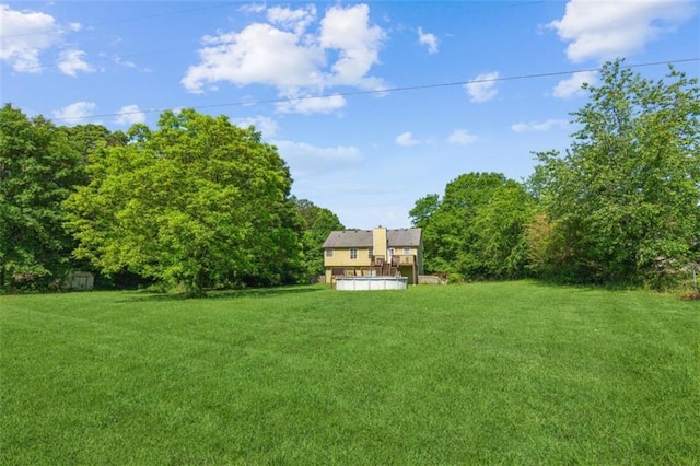 60 Boardwalk Ave, Covington, GA 30016 - view of green lawn featuring a storage unit