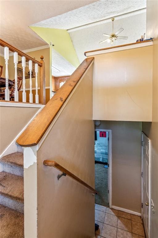 60 Boardwalk Ave, Covington, GA 30016 - stairway featuring a ceiling fan, tile patterned flooring, and crown molding