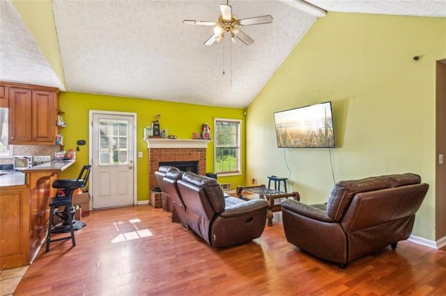 60 Boardwalk Ave, Covington, GA 30016 - living room featuring a ceiling fan, plenty of natural light, light wood-style flooring, beamed ceiling, and high vaulted ceiling