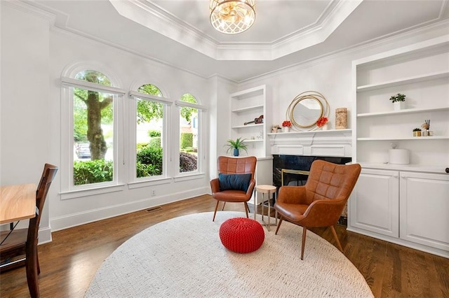 3714 Westbrooke Cir NE, Brookhaven, GA 30319 - living area featuring dark wood-type flooring, a high end fireplace, ornamental molding, baseboards, and a raised ceiling