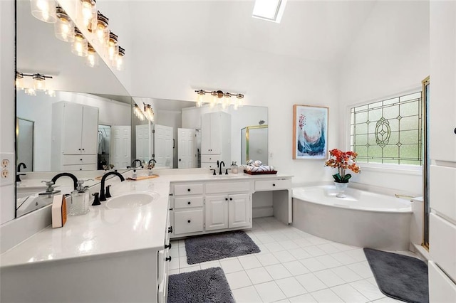 3714 Westbrooke Cir NE, Brookhaven, GA 30319 - bathroom with high vaulted ceiling, a garden tub, tile patterned floors, double vanity, and an enclosed shower