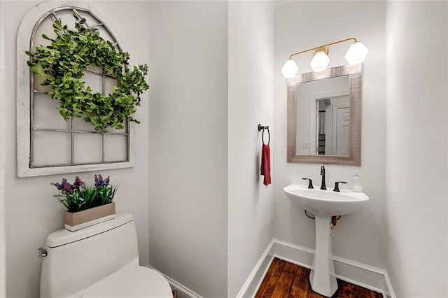 3714 Westbrooke Cir NE, Brookhaven, GA 30319 - half bath featuring baseboards, toilet, and wood finished floors