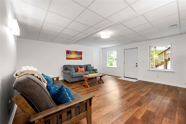3714 Westbrooke Cir NE, Brookhaven, GA 30319 - living room with a drop ceiling, hardwood / wood-style floors, and baseboards
