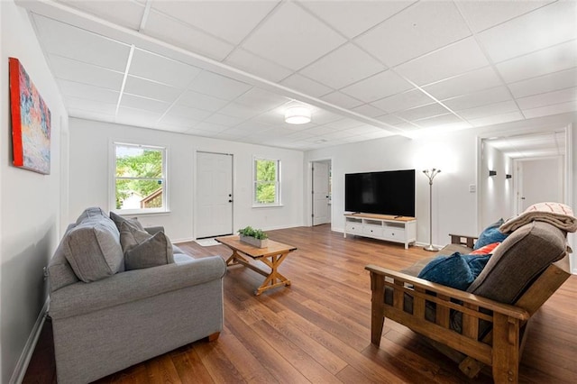 3714 Westbrooke Cir NE, Brookhaven, GA 30319 - living area featuring a drop ceiling, wood finished floors, and baseboards