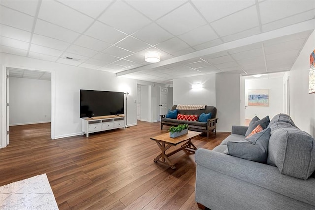 3714 Westbrooke Cir NE, Brookhaven, GA 30319 - living room with dark wood-style floors, a paneled ceiling, and baseboards