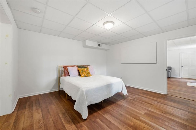 3714 Westbrooke Cir NE, Brookhaven, GA 30319 - bedroom with wood finished floors, baseboards, and a drop ceiling