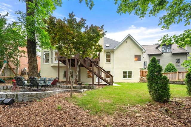 3714 Westbrooke Cir NE, Brookhaven, GA 30319 - rear view of property featuring stairway, stucco siding, a patio, a deck, and a playground