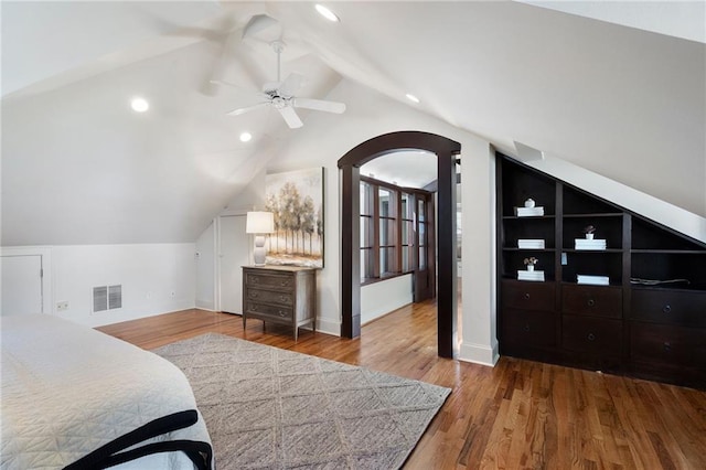 bedroom with visible vents, lofted ceiling, ceiling fan, wood finished floors, and recessed lighting