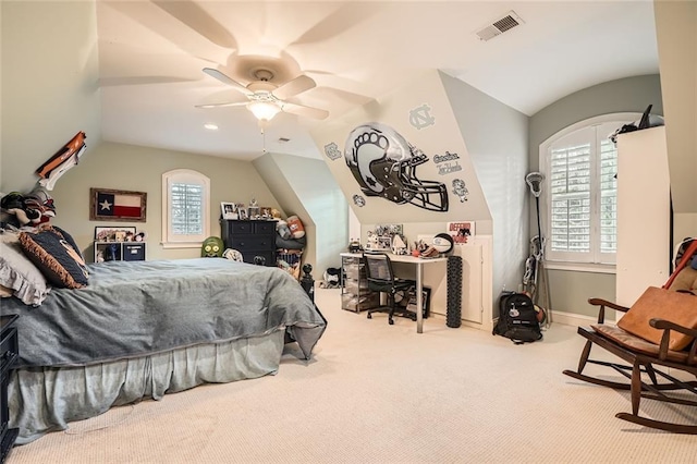 bedroom featuring ceiling fan, light colored carpet, and lofted ceiling