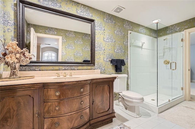 bathroom with vanity, a shower with shower door, and toilet